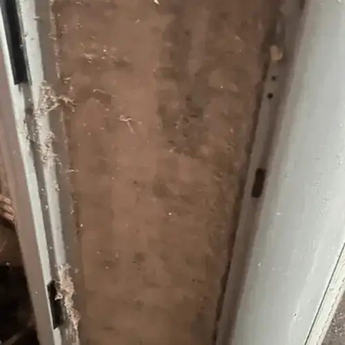 The inside of a return duct coated in dust and lint
